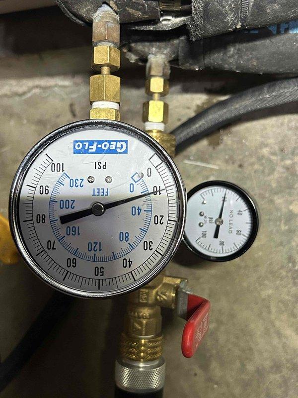 Completed final scheduled maintenance visit on 15-year-old geothermal cooling system. Performed comprehensive AC tune-up including system pressure checks using calibrated GEO-FLO gauges, which confirmed proper refrigerant pressures at 0 PSI static condition. Inspected and evaluated filter housing assembly, noting sediment accumulation in clear housing that will require monitoring. Verified all brass fittings and connections for integrity, checked valve operations with red-handled service valve, and documented system baseline performance. All geothermal-specific components inspected and found operating within normal parameters for system age. System operational and ready for cooling season.