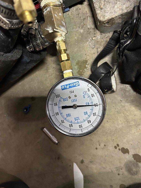 Completed final scheduled maintenance visit on 15-year-old geothermal cooling system. Performed comprehensive AC tune-up including system pressure checks using calibrated GEO-FLO gauges, which confirmed proper refrigerant pressures at 0 PSI static condition. Inspected and evaluated filter housing assembly, noting sediment accumulation in clear housing that will require monitoring. Verified all brass fittings and connections for integrity, checked valve operations with red-handled service valve, and documented system baseline performance. All geothermal-specific components inspected and found operating within normal parameters for system age. System operational and ready for cooling season.