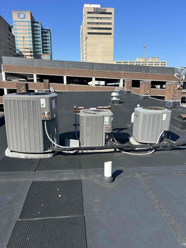 Responded to no cooling complaint on commercial rooftop installation with three packaged HVAC units. Performed diagnostic evaluation on non-operational unit, which showed significant age-related deterioration including severe paint failure and corrosion on exterior cabinet panels. Documented equipment condition with photographic evidence showing extensive weathering on 20+ year old system. Advised property owner of unit's condition and discussed replacement options given the advanced age of equipment and extent of cabinet deterioration affecting structural integrity.