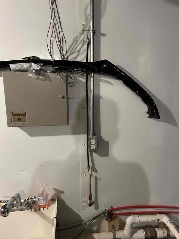 Relocated existing sump pump receptacle to a higher elevation on the wall to improve safety and accessibility. Installed a new dedicated 120V 20-amp circuit for the sump pump system, routing the wiring through liquid-tight flexible metallic conduit that runs vertically down the wall for proper protection and code compliance. All electrical connections were secured in approved junction boxes with proper wire management, ensuring the sump pump system operates safely and reliably in the utility space.