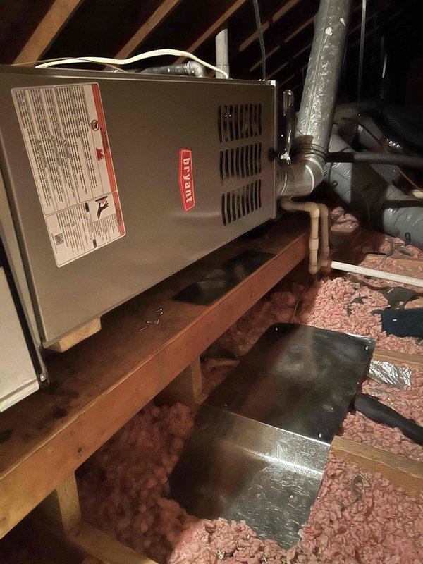 Installed Bryant 80% efficiency 70,000 BTU furnace (model 800SB36070M14) in attic location. Built custom transition piece to accommodate proper fitment between new furnace model and existing evaporator coil. Connected unit to existing flue piping, installed electrical shut-off switch, gas shut-off valve, flexible gas line connector, and flame roll-out protection. Installed standard-sized air filter rack and transition to evaporator coil to complete system integration.