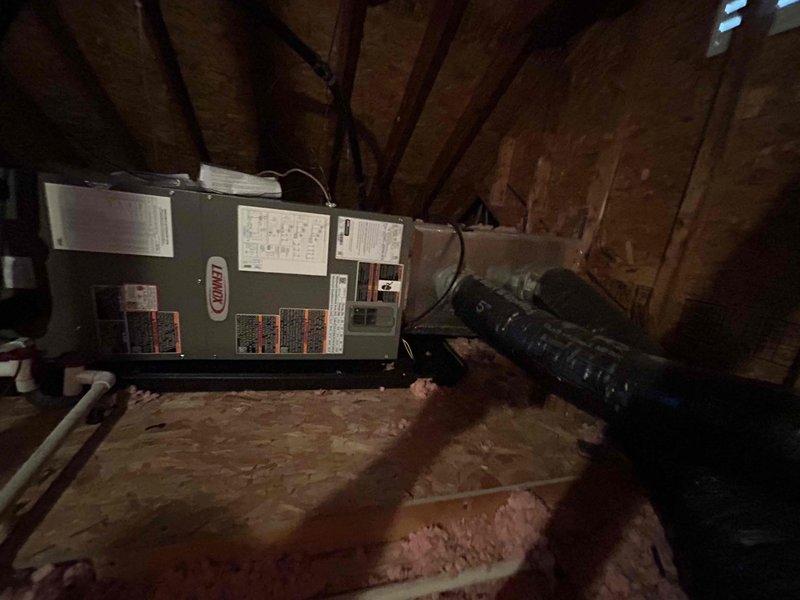 Completed full HVAC system replacement including installation of Carrier 4-ton 16 SEER2 heat pump (model GH5SAN54801A), Carrier 4-ton air handler (model FJ5ANXC48L00) in attic space, and Carrier 20kW heat kit (model TU-EC-20BKB) with digital thermostat. Removed and properly disposed of existing equipment, installed outdoor unit on gravel pad with snow legs, electrical disconnect box, electrical whip kit, insulated refrigerant lines, and refrigerant line filter. Completed all electrical connections via conduit to exterior wall-mounted components, pulled applicable permits, and verified system operation and code compliance.