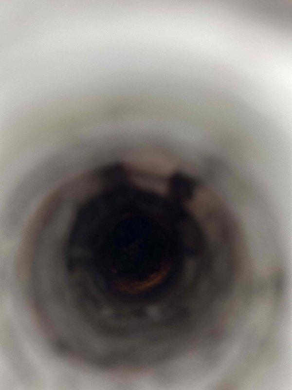 Responded to callback for system not reaching target temperatures with elevated indoor humidity levels. Found condensate drain line completely clogged, causing drainage issues and contributing to high humidity conditions. Cleared drain line obstruction and adjusted blower motor speed to tap four setting to improve dehumidification performance. Discussed long-term solutions including whole house dehumidifier installation and potential variable speed system upgrade if humidity control issues persist.