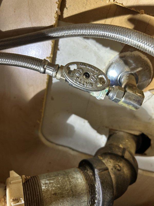 Conducted thorough plumbing inspection to assess previously identified leak and provide detailed estimate for piping repairs. Examined flexible supply line connections at fixture, noting braided stainless steel supply lines with visible age-related wear and older brass fittings showing oxidation and mineral deposits. Inspected under-sink plumbing configuration including P-trap assembly, shut-off valves, and water supply connections. Documented all plumbing components with photographic evidence to support comprehensive estimate for necessary repairs and replacements.