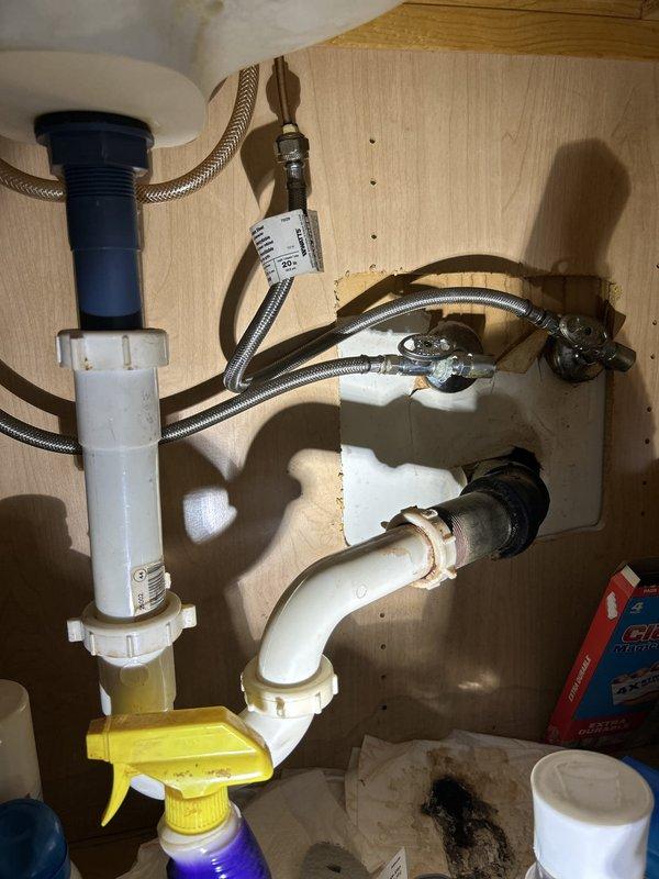 Conducted thorough plumbing inspection to assess previously identified leak and provide detailed estimate for piping repairs. Examined flexible supply line connections at fixture, noting braided stainless steel supply lines with visible age-related wear and older brass fittings showing oxidation and mineral deposits. Inspected under-sink plumbing configuration including P-trap assembly, shut-off valves, and water supply connections. Documented all plumbing components with photographic evidence to support comprehensive estimate for necessary repairs and replacements.