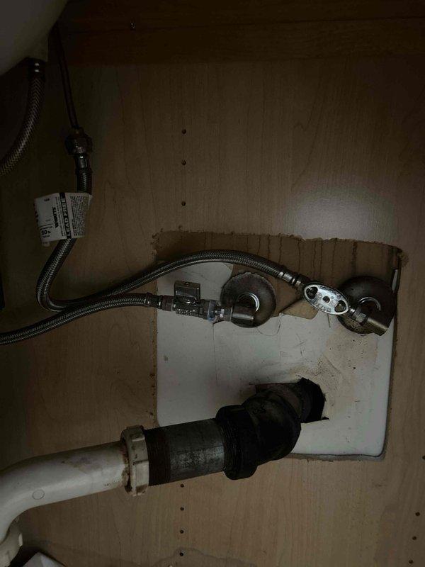Replaced a leaking shut-off valve for the bathroom sink with a new angle stop assembly. The original valve was failing and causing water seepage in the vanity cabinet, which was successfully resolved with the installation of the new fixture and braided supply line connection.