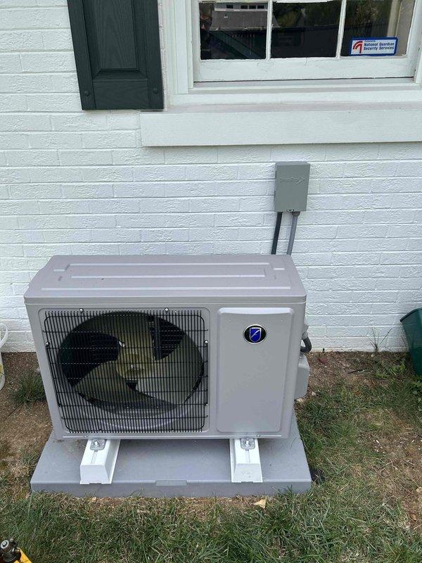 Completed residential installation of Friedrich 12K BTU ductless mini-split system (FPHSR12A1C outdoor unit, FAHSW12A1C indoor wall mount). Installed outdoor condenser on pad with snow legs, mounted indoor wall unit, ran refrigerant line set with insulation, and established electrical service with new 230V 20-amp circuit including breaker, disconnect box, and electrical whip. Job requires return visit to complete final startup and system commissioning.