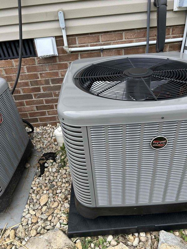 Completed full residential HVAC system installation including Ruud 2.5 ton 15 SEER2 heat pump (RP14AY30AJ2NA), 2.5 ton air handler (RH2TY3617STANNJ), 5kW heat kit (RXBH-1724A05J-B), and digital thermostat. Installed outdoor unit on composite pad with decorative rock base, snow legs, electrical whip and disconnect box, refrigerant line insulation and filter. Indoor air handler installation included SS2 coil drain safety water sensor, overflow drain pan with water sensor, trap, transition to existing ductwork, and standard air filter rack. Added 6 inches of blown-in insulation to attic space to improve energy efficiency. All work completed per code requirements with applicable permits, proper refrigerant line installation, and system startup. System tested and operational with 10-year parts warranty and 1-year labor warranty provided.