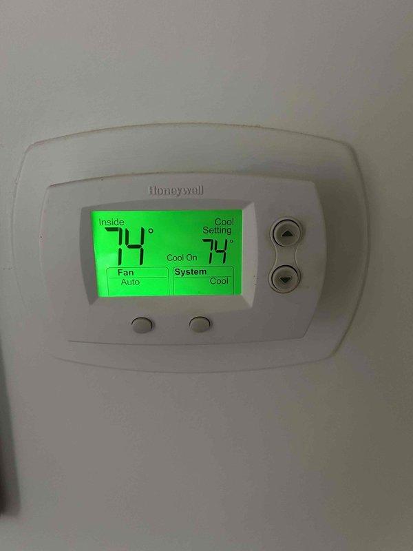 Completed routine AC tune-up on American Standard/Trane system (Model AUD100C9A5K2). Performed standard maintenance including inspection of all components, verified proper system operation with Honeywell thermostat showing 74° setpoint and cooling cycle functioning correctly. No issues identified during service; system operating within normal parameters.