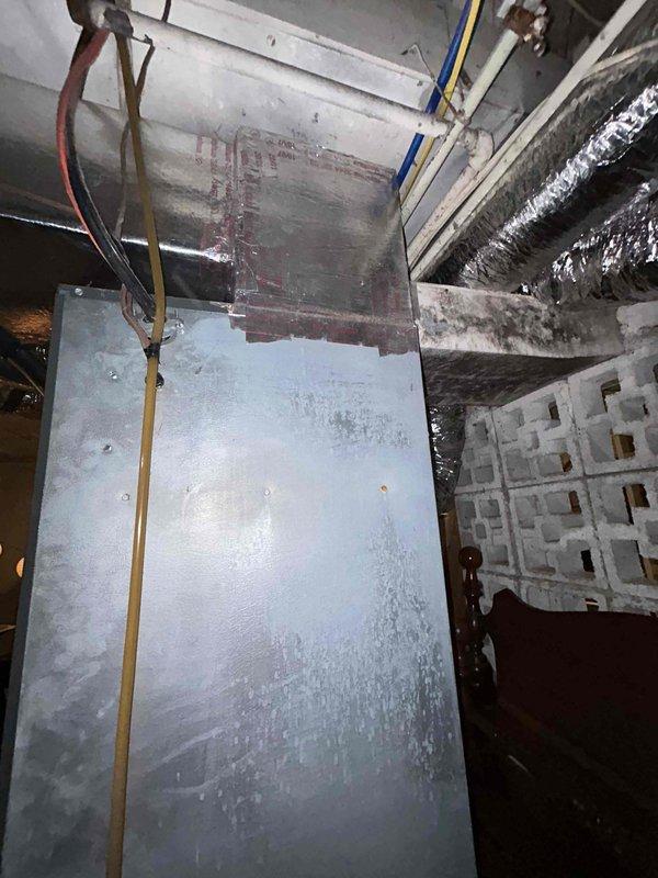 Responded to service call for air conditioning system with fan running continuously even when thermostat was set to off position, requiring breaker shutdown to stop operation. Upon arrival, inspected 9-year-old air conditioning unit and associated components. Found significant debris accumulation around exterior unit base restricting airflow and proper drainage. Observed condensation issues on indoor air handler with moisture buildup on metal surfaces indicating potential drainage concerns.

Diagnosed faulty thermostat control circuit preventing proper fan relay operation. Tested thermostat wiring and relay functionality at air handler. Cleared leaf debris and organic matter from around outdoor unit base and foundation area to restore proper airflow and prevent future moisture intrusion. Addressed condensation drainage concerns at indoor air handler. Corrected thermostat control circuit issue to restore proper fan cycling operation. Verified system responds correctly to thermostat comm