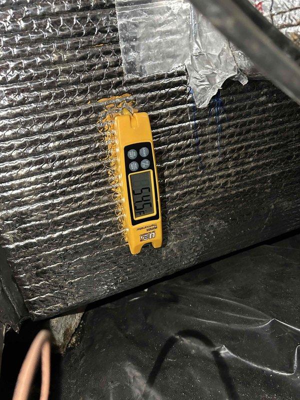 Responded to no cooling complaint on 3-year-old system with indoor unit located in crawlspace. Performed diagnostic evaluation and temperature measurements at supply ductwork registering 54.1°F and return air at 91.5°F, confirming adequate temperature split and proper system operation at time of inspection. System found operating normally with no faults detected; customer had replaced filter previous week as recommended during last service visit.