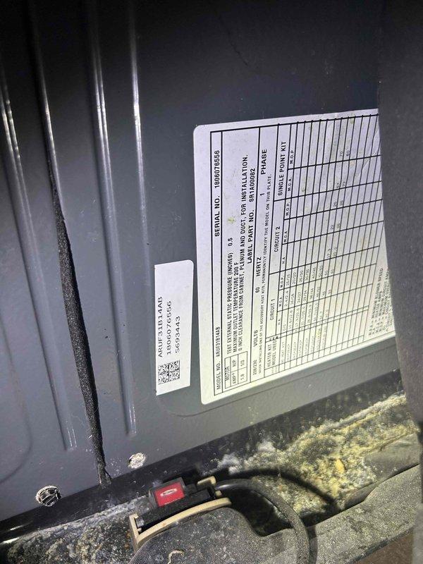 Responded to callback for system that would not operate following previous thermostat scheduling service. Upon arrival, thermostat displayed "cooling on" but outdoor unit showed no signs of operation. Inspected Trane condenser unit located in brick-enclosed courtyard area with multiple HVAC systems. Found significant accumulation of dirt, debris, and biological growth in lower equipment compartment that had developed since previous visit. Cleaned contaminated areas, verified electrical connections at component level, and restored system to normal operation. Unit tested successfully with proper cooling cycle engagement and thermostat communication confirmed.