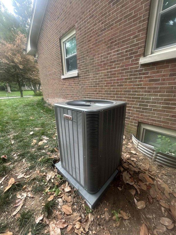 Completed residential installation of Lennox 5-ton single stage air conditioning system with 14.4 SEER2 rating, model ML14KC1-060 condenser unit and CK40CT-60D evaporator coil. Installed outdoor unit on concrete pad against exterior brick wall with electrical disconnect box, whip kit, and refrigerant line insulation. Installed refrigerant line filter drier and completed transition from evaporator coil to existing ductwork. Mounted and configured new S200 thermostat for system control. Installed SS2 coil drain safety water sensor for overflow protection. Completed refrigerant charging, electrical connections, and full system testing to verify proper operation and performance.