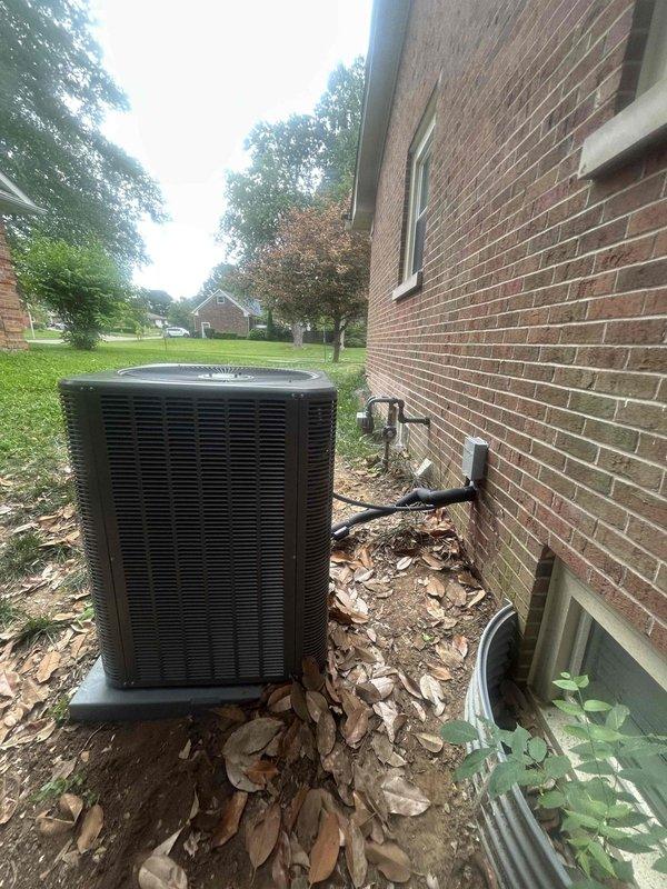 Completed residential installation of Lennox 5-ton single stage air conditioning system with 14.4 SEER2 rating, model ML14KC1-060 condenser unit and CK40CT-60D evaporator coil. Installed outdoor unit on concrete pad against exterior brick wall with electrical disconnect box, whip kit, and refrigerant line insulation. Installed refrigerant line filter drier and completed transition from evaporator coil to existing ductwork. Mounted and configured new S200 thermostat for system control. Installed SS2 coil drain safety water sensor for overflow protection. Completed refrigerant charging, electrical connections, and full system testing to verify proper operation and performance.