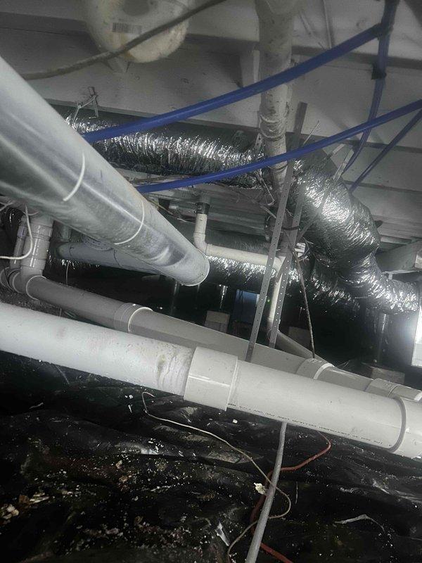 Completed comprehensive plumbing repair involving the removal and replacement of deteriorated cast iron drain piping in the crawl space with new PVC drainage lines, terminating at the foundation wall. Installed a new toilet and added a cleanout access point to facilitate future maintenance and inspection of the drainage system.