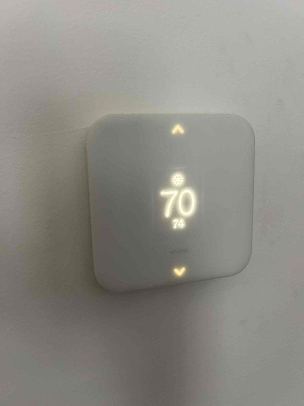 Responded to service call for upstairs HVAC system operating below full capacity. Performed comprehensive system evaluation of 20-year-old furnace and dual outdoor condensing units. Verified thermostat functionality showing 70°F setpoint and confirmed system maintains partial heating and cooling capability despite age-related efficiency decline. Documented equipment condition including outdoor units positioned on gravel pad with proper electrical connections and refrigerant line routing. Provided customer with assessment of aging system performance and recommendations for continued operation or replacement considerations given equipment age exceeding typical service life expectancy.