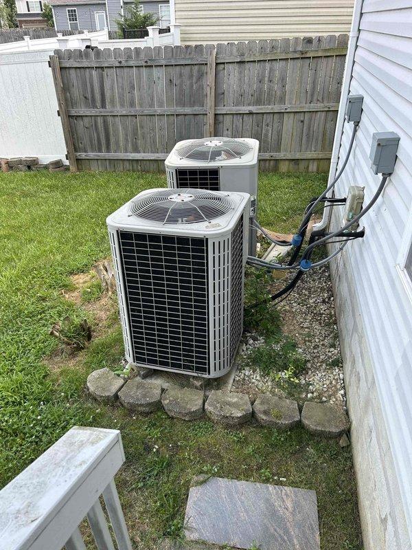 Responded to service call for upstairs HVAC system operating below full capacity. Performed comprehensive system evaluation of 20-year-old furnace and dual outdoor condensing units. Verified thermostat functionality showing 70°F setpoint and confirmed system maintains partial heating and cooling capability despite age-related efficiency decline. Documented equipment condition including outdoor units positioned on gravel pad with proper electrical connections and refrigerant line routing. Provided customer with assessment of aging system performance and recommendations for continued operation or replacement considerations given equipment age exceeding typical service life expectancy.