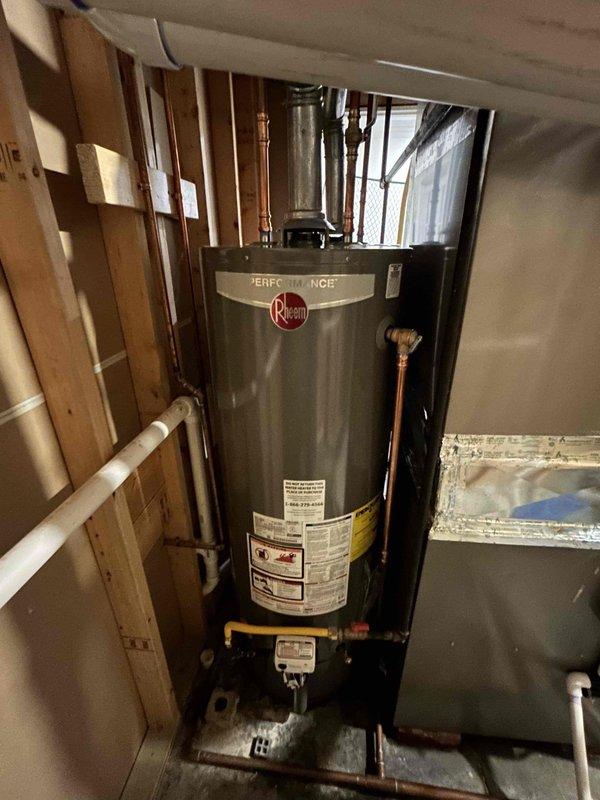 Removed and disposed of two existing water heaters from the utility area. Installed two customer-supplied Rheem Performance 50-gallon natural gas water heaters, including all necessary connections to existing copper supply lines and gas piping. Connected flue venting to ensure proper exhaust of combustion gases. Installed brass shut-off valves and fittings at inlet and outlet connections. Tested all gas connections for leaks, verified proper ignition and burner operation, and confirmed adequate water flow and temperature performance. Inspected all plumbing connections to ensure no water leaks were present prior to completion.