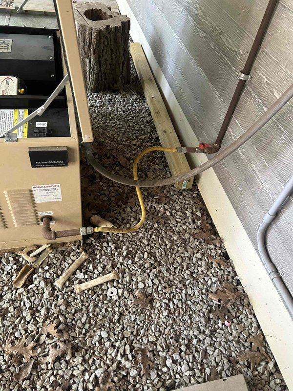 Responded to service call for Generac generator repeatedly tripping fuses. Performed diagnostic inspection of exterior-mounted electrical service equipment including disconnect panel, meter base, and associated conduit connections. Inspected attic-mounted transfer switch and related electrical components. Documented equipment configuration with photographs and applied service stickers as required.