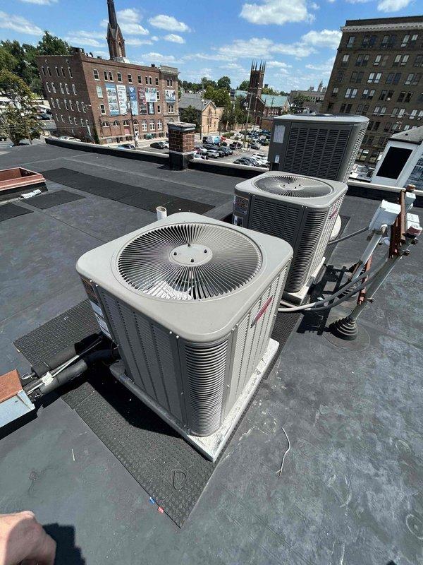 Completed full residential HVAC system installation including Lennox 2-ton 17 SEER two-stage air conditioner (ML17KC2-024-230), evaporator coil (CK40CT-36B-71), and 45K BTU 97% efficiency two-stage gas furnace with variable speed blower (ML296UH045XV36B). Installed outdoor unit pad, electrical whip kit, disconnect box, insulated refrigerant lines with filter drier, digital thermostat, and SS2 coil drain safety water sensor. Fabricated transition from evaporator coil to existing ductwork, utilized crane service for rooftop outdoor unit placement, obtained applicable permits, removed and disposed of existing equipment, tested all system operations, and enrolled system in annual care maintenance plan with semi-annual inspections.