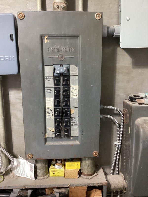 Conducted comprehensive electrical site assessment for generator installation at residential garage facility. Evaluated existing electrical infrastructure including main service panel, circuit breaker configuration, and available conduit pathways. Documented current electrical panel capacity, circuit labeling system, and identified suitable connection points for generator transfer switch integration. Assessed adequate clearances and mounting locations for automatic transfer switch equipment in accordance with NEC requirements. Photographed existing electrical distribution system and mechanical room layout to develop accurate material list and labor estimate for proposed standby generator installation.