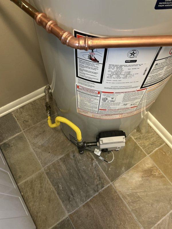 Completed installation of Bradford White 40-gallon gas water heater (22" x 48 1/16" short model) in residential utility space. Removed and disposed of existing water heater, then installed new unit with all necessary copper piping, fittings, and connections to existing water supply lines. Reconnected flexible gas line with appropriate shutoff valve, installed expansion tank at top of unit, and reconnected electrical supply for ignition system. All work performed in compliance with code requirements, including obtaining proper plumbing permit and scheduling inspection.