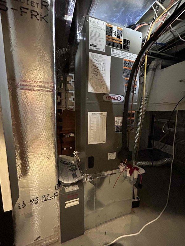 Completed full HVAC system replacement installing Lennox 2.5 ton 16.7 SEER2 variable capacity side discharge heat pump (ML15KSPV-030-230) with variable speed air handler (CBK45UHVT-30), electric heat kit (ECB45-15CB-P), and S200 thermostat. Outdoor installation included new equipment pad, snow legs, electrical disconnect box with whip kit, refrigerant line set with insulation, and refrigerant line filter. Indoor air handler installation included trap, SS2 coil drain safety water sensor, ceiling saver overflow drain pan with water sensor, transition to existing ductwork, and standard air filter rack. All applicable permits obtained, existing equipment removed and disposed of per code requirements, and installation completed in compliance with manufacturer specifications and local building codes.