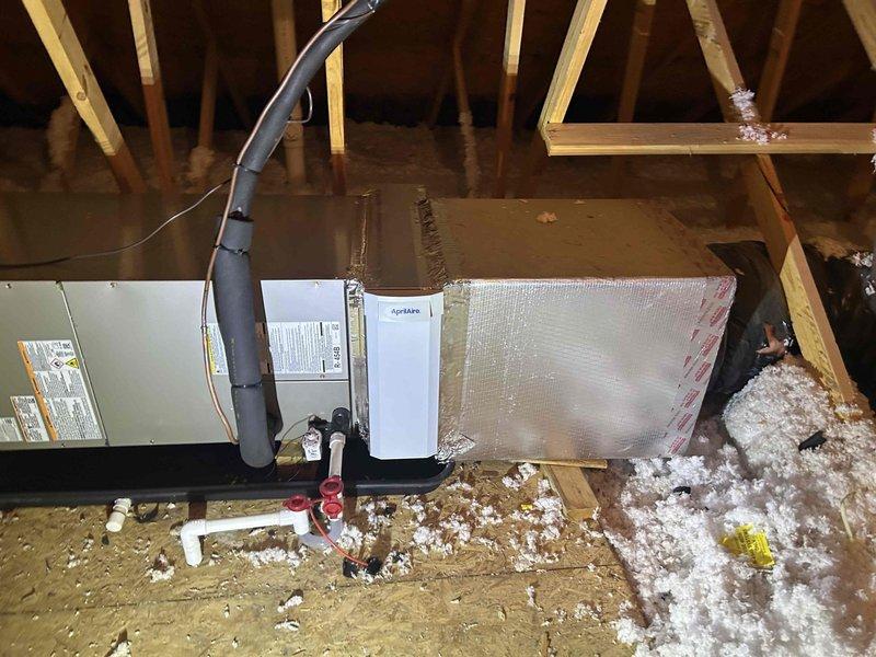 Completed full residential HVAC system installation featuring a Bryant 2-ton, 14.3 SEER2 single-stage heat pump system with model GH5SAN02400A outdoor unit and FJ5ANXB24L00 air handler installed in attic space. Removed and properly disposed of existing equipment, then installed new system including 10KW auxiliary heat kit, AprilAire 16x25" media cabinet with custom transition fabricated from original 21" cabinet to 17.5" cabinet to accommodate existing ductwork configuration.

Installed air handler in attic with complete drainage system including trap, SS2 coil drain safety water sensor, and "Ceiling Saver" overflow drain pan equipped with water sensor for dual-level protection against water damage. Constructed transition to integrate with existing ductwork and installed standard-sized air filter rack for maintenance accessibility. Secured flexible ductwork with proper metal strapping and completed all necessary attic penetrations while maintaining insulation integrity around installat