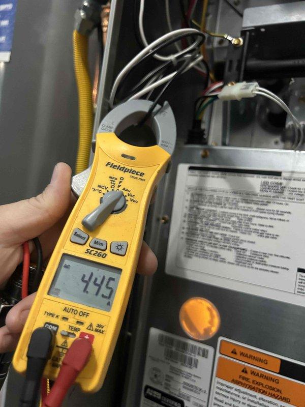Responded to no-cool call on 3-year-old residential air conditioning system with non-responsive thermostat. Upon inspection, discovered system was without power due to tripped breaker or loose connection. Verified proper air filter installation (16x25x1) and conducted electrical diagnostics using multimeter, measuring capacitor microfarad reading of 445 on system components. Restored power to unit, confirmed thermostat communication and system operation, and verified cooling cycle initiated properly with all zones responding throughout the home.