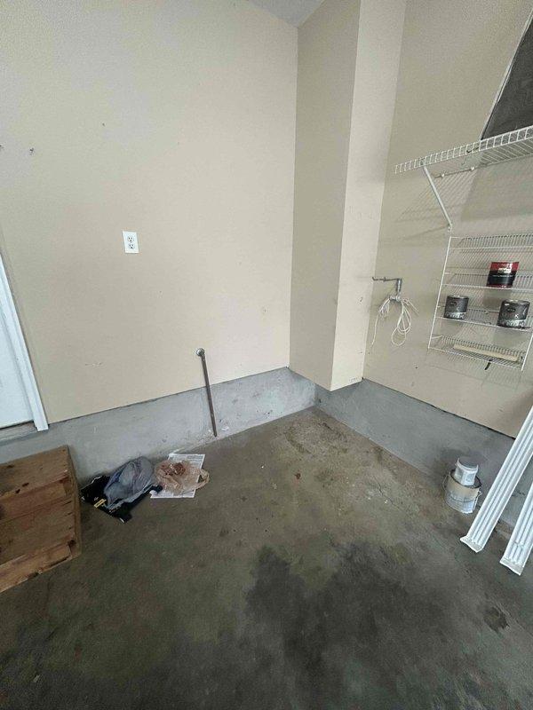 Conducted site assessment for water heater relocation in residential utility space. Current A.O. Smith water heater is positioned in alcove blocking access to washer and dryer hookups. Evaluated existing installation including gas connections, water supply lines, venting system, and electrical requirements. Documented current placement with measurements and photographic evidence. Prepared estimate for relocating unit to alternative position that will provide unobstructed access to laundry connections while maintaining code compliance for clearances, venting, and utility connections.