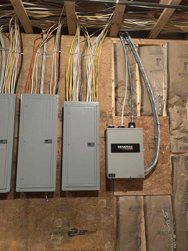 Responded to service call for 10-year-old Generac generator that failed to activate during recent power outage. Performed diagnostic inspection of generator system, transfer switch, and associated electrical panels in basement utility room. Documented existing electrical infrastructure including Generac automatic transfer switch, multiple breaker panels, and wiring configurations for service records.