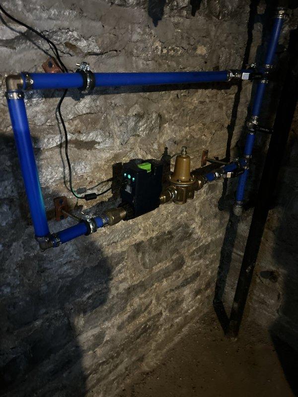 Conducted a comprehensive plumbing estimate for replacement of an existing 40-gallon gas-fired tank water heater located in the basement. Assessed the current installation, including gas supply lines, venting system, pressure relief valve piping, and water supply connections. Documented existing blue PVC condensate drainage system with brass pressure regulator and electronic control components, as well as overhead copper piping infrastructure and mechanical support framework. Evaluated accessibility, clearances, and code compliance requirements for new water heater installation.