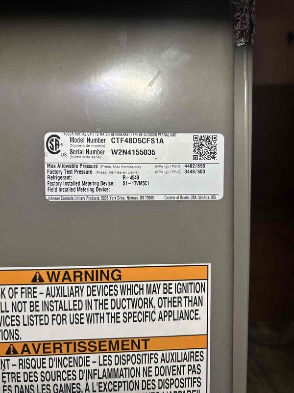 Completed routine AC tune-up on a 1-year-old Johnson Controls indoor unit (Model CTF48D5CFS1A) utilizing R410A refrigerant. Performed standard maintenance procedures including system inspection, filter assessment, and verification of proper airflow direction on 20x20 filter housing. Unit operating within normal parameters with no deficiencies noted.
