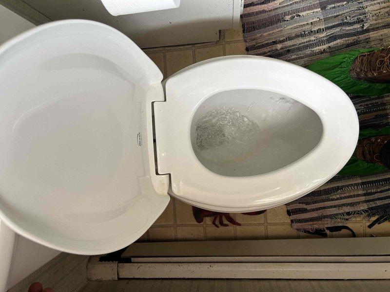 Completed comprehensive 65-point plumbing inspection in response to customer report of continuous running water. Conducted thorough examination of all accessible plumbing fixtures and components throughout the property. Inspected toilet assembly, including fill valve, flapper, flush valve, and tank components for signs of leakage or malfunction that could cause continuous water flow. Evaluated water supply lines, shut-off valves, and connections for proper operation and potential leak sources. Examined basement utility area where deteriorated concrete flooring and water staining on tiled walls indicated possible historical moisture intrusion issues. Documented all findings with photographic evidence for customer records and future reference.