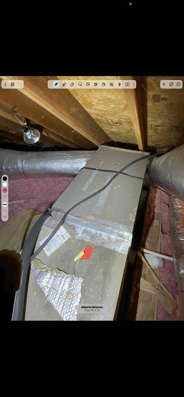 Responded to warranty call regarding whistling noise from geothermal system installed in February. Upon inspection, discovered flexible metallic ductwork in attic space was compressed and bunched, creating accordion-like configuration that was causing airflow restriction and whistling sound. Inspected HVAC duct system, junction box, and plenum connections throughout attic space. Documented existing installation conditions showing compressed flex duct, insulation placement, and system components. Identified improper duct installation as source of noise complaint.
