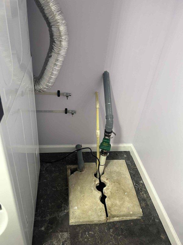 Conducted on-site assessment for sump pump relocation in mechanical room and provided estimate for bucket pump installation in adjacent laundry area. Documented existing sump pump configuration elevated on concrete blocks with drainage hose and evaluated utility room layout including gas line locations and HVAC ductwork for safe relocation planning. Assessed laundry room conditions showing visible floor water damage and moisture issues requiring separate bucket pump system to address drainage concerns.