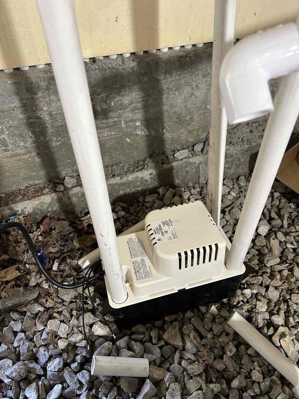 Returned to site to address post-installation issues on multi-zone ductless mini-split system. Installed Mitsubishi Electric wireless thermostats on indoor head units per customer preference and original sales agreement, replacing standard remote controllers. Diagnosed and repaired water leakage on two of three indoor air handlers, restoring units to operational status. Replaced undersized outdoor unit pad with larger concrete pad to properly support condenser stand, ensuring adequate clearance and stability. Secured outdoor unit stand feet to pad for improved structural integrity and code compliance. Verified all indoor units operating without leakage, thermostat communication functioning properly, and outdoor unit securely mounted on appropriately sized pad. System tested and confirmed operational.