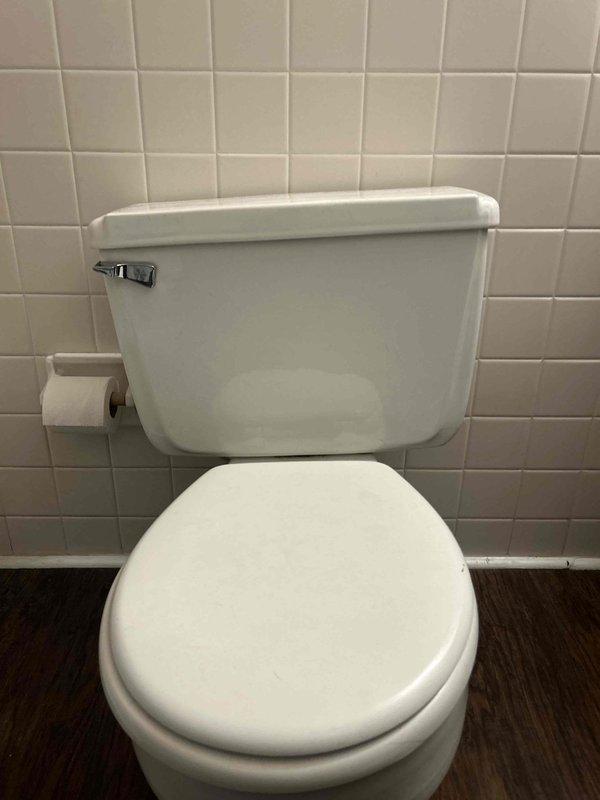 Responded to water leak reported in guest bathroom with steady flow causing water damage to unit below. Performed diagnostic inspection to locate source of leak. Inspected toilet installation, supply line connections, wax ring seal, and surrounding plumbing fixtures. Identified leak source and completed necessary repairs to stop water intrusion. Verified proper toilet function and confirmed no active leaking upon completion. Documented conditions with photographs for service records.