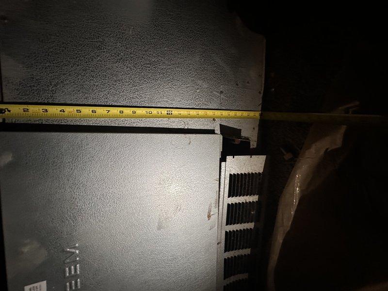 Conducted comprehensive estimate for complete furnace replacement system. Existing furnace unit is approximately 40 years old and currently operational but has exceeded its expected service life significantly. Performed thorough assessment of existing HVAC infrastructure including ductwork configuration, clearances, and installation accessibility in basement mechanical space.

Documented existing equipment dimensions and spatial constraints using precision measurements to ensure proper sizing for replacement unit. Evaluated condition of existing supply and return ductwork, noting flexible duct runs and metal trunk lines. Assessed structural conditions including deteriorated ceiling insulation showing significant sagging and compression, which may require attention during replacement installation.

Photographed existing furnace unit, ductwork connections, and surrounding mechanical space to provide accurate documentation for equipment specifications and installation planning. Measured a