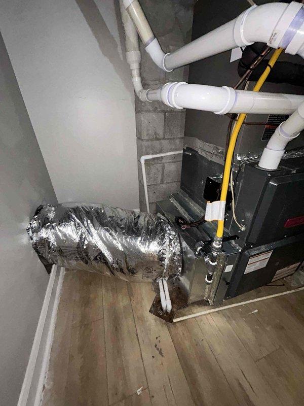 Completed warranty follow-up on recent AC and coil installation. Identified deficiency in existing return air configuration where return duct was improperly routed through back of furnace cabinet, resulting in inadequate return airflow and compromised serviceability. Modified HVAC system design to correct return air pathway and ensure proper airflow requirements. Installed new flexible return ductwork with appropriate sizing to meet system specifications. Verified refrigerant charge on R454B system using manifold gauges, confirming superheat and subcooling within manufacturer specifications. System now operating with adequate return air and full accessibility for future maintenance.