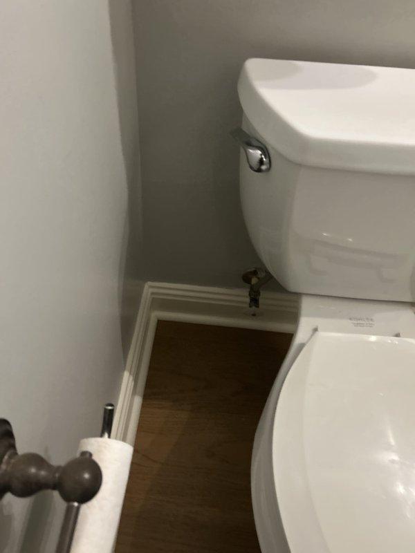 Responded to customer request to temporarily remove toilet and pedestal sink to facilitate bathroom flooring renovation. Successfully disconnected water supply line, removed toilet from corner installation, and relocated both fixtures to garage for secure storage during construction period. Return visit scheduled in 10 days to reinstall fixtures upon completion of new flooring.