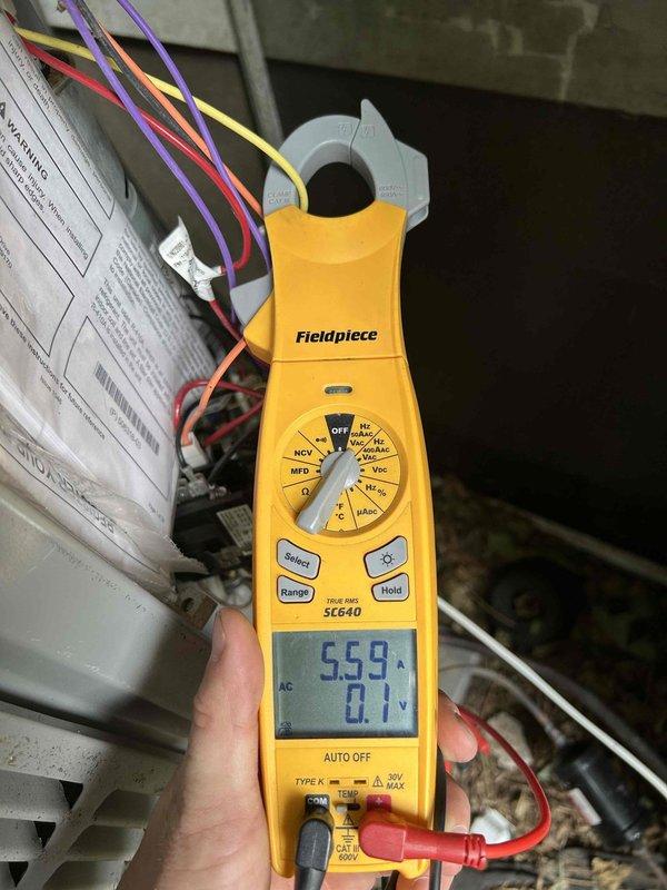 Responded to no cooling call on 2-year-old electric heat pump system. Upon arrival, performed electrical diagnostics on indoor air handler unit and discovered severely damaged wire with deteriorated insulation and exposed copper conductors causing system failure. Measured abnormal amperage draw of 55.9A during testing, confirming electrical fault. Repaired damaged wiring, restored proper electrical connections, and verified system operation with all parameters within normal range.