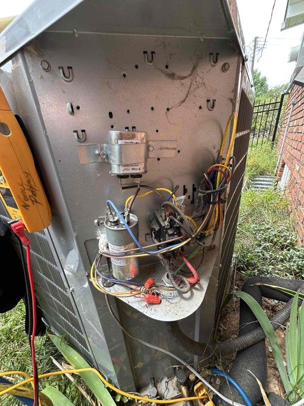 Responded to no cooling call on 6-year-old residential air conditioning system experiencing repeated circuit breaker trips. Upon arrival, performed visual inspection of outdoor condensing unit and removed access panel to examine electrical components. Using digital multimeter, tested capacitor functionality and measured microfarad readings. Initial diagnostic testing revealed capacitor reading of 0.43 MFD, indicating failed run capacitor well below manufacturer specifications. Inspected all visible wiring connections, contactor assembly, and associated electrical components for signs of damage, corrosion, or thermal stress that could contribute to overcurrent condition causing breaker trips. Documented equipment condition with photos showing interior components and diagnostic measurements for service records and repair recommendations.