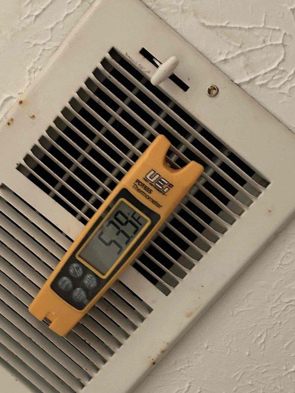 Responded to no cooling complaint on 9-year-old electric heat pump system with thermostat set to 72°F but reading 79°F and blowing warm air. Upon arrival, performed diagnostic evaluation of refrigerant system using digital manifold gauge set. Measurements revealed system operating with R410A refrigerant at 1285 psig high side pressure and 160 psig low side pressure, with subcooling reading of 51°F and superheat conditions indicating potential refrigerant charge issues. Supply air temperature measured at 95°F at ceiling register, confirming inadequate cooling performance. System showed signs of low refrigerant charge based on pressure readings and temperature differentials. Documented refrigerant pressures, temperatures, and operating conditions for further diagnosis and repair recommendations.