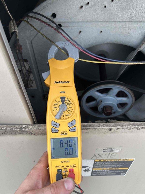 Responded to no cooling call on AC unit with repeated breaker tripping issue. Performed diagnostic testing using clamp meter to measure electrical draw and voltage at the air handler. Inspected blower assembly, motor components, and electrical connections for signs of short circuit or excessive amperage draw that would cause breaker trips.