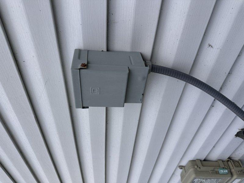 Completed full system replacement estimate for 20+ year old HVAC equipment. Evaluated existing dual outdoor condenser units mounted on weathered wooden platform with electrical junction box installation on corrugated metal siding. Customer requested expedited Friday afternoon appointment and expressed openness to all equipment options as first-time HVAC purchaser, with financing consideration based on pricing.