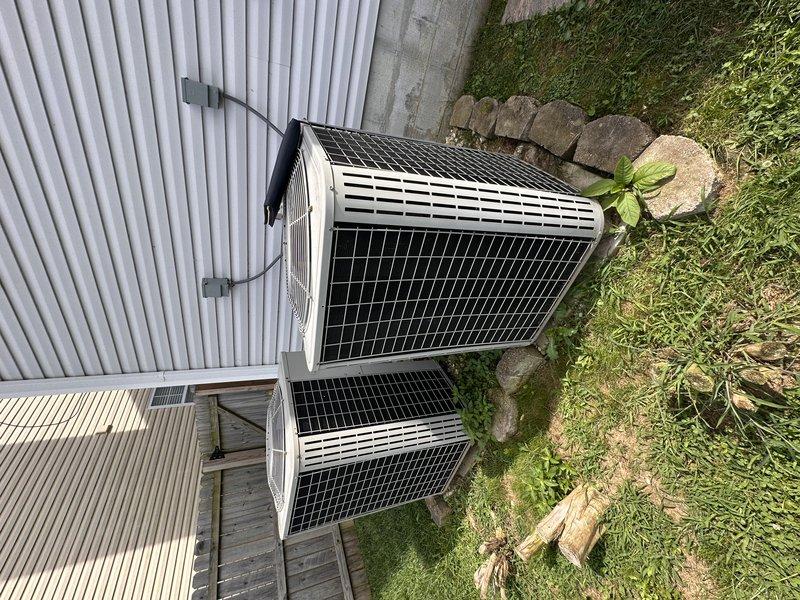 Completed full system replacement estimate for 20+ year old HVAC equipment. Evaluated existing dual outdoor condenser units mounted on weathered wooden platform with electrical junction box installation on corrugated metal siding. Customer requested expedited Friday afternoon appointment and expressed openness to all equipment options as first-time HVAC purchaser, with financing consideration based on pricing.