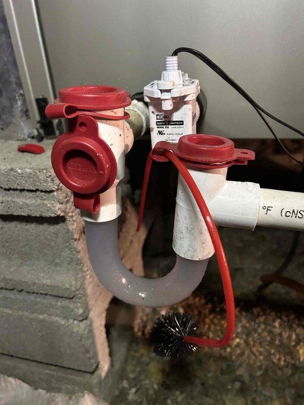 Completed Gold Level prepaid maintenance on single heat pump/air handler system located in crawlspace. Performed comprehensive system inspection including electrical measurements using clamp meter, verified capacitor readings at 3448 microfarads, and inspected condensate drain assembly with trap and safety switch. Confirmed all components operating within normal parameters and documented system condition with photos for service records.