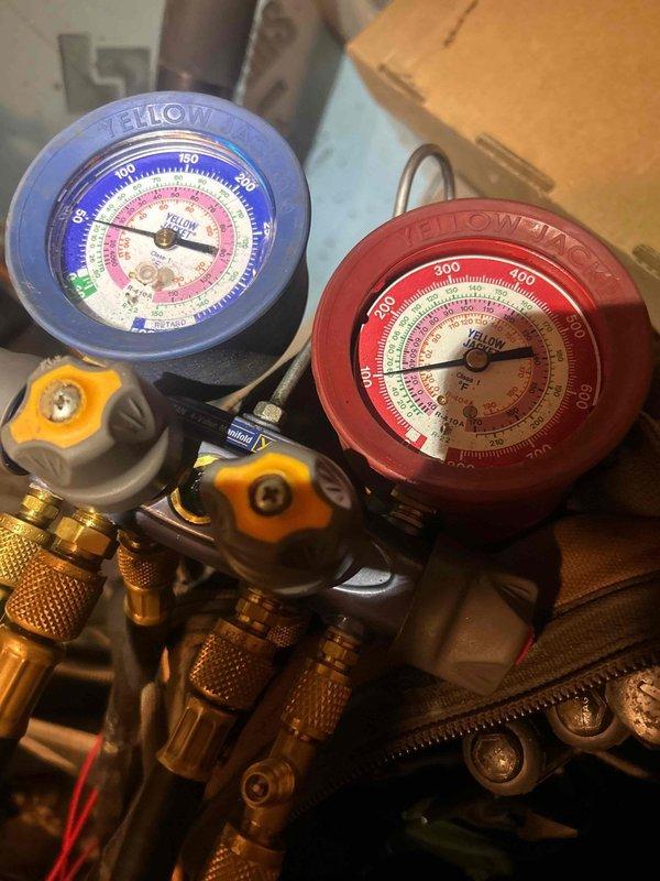 Responded to no cooling complaint on downstairs geothermal system. Upon arrival, found thermostat displaying incorrect temperature readings, preventing proper system operation. Performed diagnostic evaluation using manifold gauges to check refrigerant pressures and system performance. Verified system parameters and identified thermostat malfunction as primary cause of cooling failure. Discussed thermostat replacement options with customer, including upgrade from existing Nest unit. Advised customer on maintenance program benefits and provided recommendation for keeping replacement air filters on-site for regular maintenance intervals.