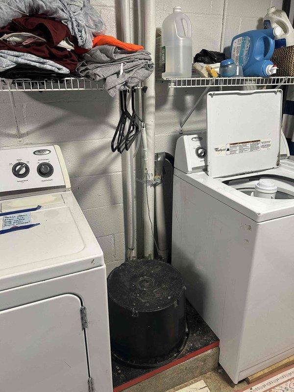 Installed a bucket pump system to handle laundry discharge in the utility area. Rerouted the existing sump pump discharge line to exit the building independently, with the discharge point positioned over the driveway. All plumbing connections completed with PVC piping, ensuring proper drainage flow and system functionality.